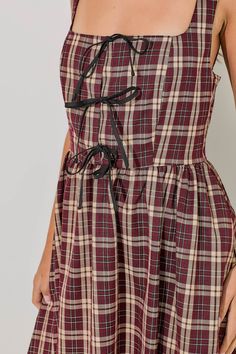 Get ready to turn heads with our Plaid Bow Midi Dress. This chic and trendy dress features a timeless plaid pattern and a charming bow detail, making it the perfect choice for any occasion. Its midi length adds a touch of sophistication, while the comfortable fabric ensures a flattering fit. Elevate your style game with this must-have dress. Trendy Dress, Plaid Bow, Midi Dress Sleeveless, Plaid Dress, Dress Sleeveless, Trendy Dresses, British Indian, Bow Detail, Plus Size Tops