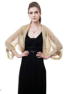 This gorgeous sheer bolero, with a loose-fitting silhouette is made of finest 100%l silk iridescent chiffon in soft pale gold color. It has luxurious details such as wide soft folds attached to the bolero's edges. The long sheer sleeves are adorned with lovely silk rosettes and vintage rose Swarovski crystal, which gives this formal jacket a truly glamorous effect. This jacket has a loose silhouette and one size fits two. XS-S: 32-34 x 25-27 x 34-36 Bust Waist Hips M-L: 36-38 x 28-30 x 38-40 Bus Formal Bolero, Bolero Long Sleeve, Women Shrug, Kebaya Lace, Gold Shawl, First Ladies, Shrugs And Boleros, Plus Size Party Dresses, Bolero Jacket