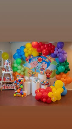 balloons and streamers decorate the entrance to a spongebob themed birthday party