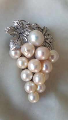 I love grape jewellery and this pin ticks so many boxes. It is 2 inches tall by 1 1/2 inches wide and is realistically done. The large cutured Akoya pearls range in size from 7mm to a whopping 10mm. The nacre on the pearls is really nice. The metal is sterling silver (tested and guaranteed) but is not hallmarked. C. 1950 and Japan made. Follow me on instagram@jettesjewels. Vintage Ysl, Fabric Necklace, Akoya Pearls, Natural Pearls, Cultured Pearls, Costume Jewelry, Necklace Set, Brooch Pin, Brooches