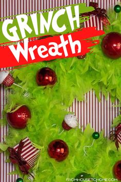 a christmas wreath made out of green and red ornaments with the words grinch wreath on it