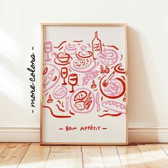 an art print with food and drinks on it in front of a wall that says bon appetit