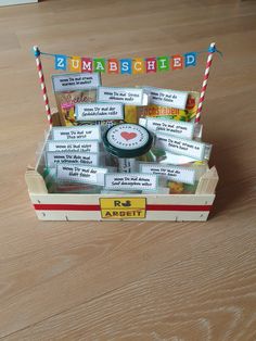 a wooden box filled with lots of cards and magnets on top of a table