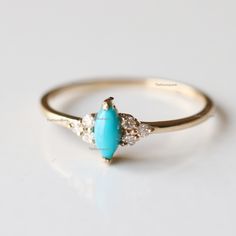 Pretty Marquise turquoise Trio diamond Engagement ring, Arizona Turquoise Ring, Gemstone Petite Ring. The stones can also be of other shape or kind. Product info: Main gemstone: turquoise Shape: Marquise cabochon Measurements: approx. 6*3mm Side stones: white diamonds Shape: round Measurements: approx. 1.5 mm Quality: I-J color, SI clarity, conflict-free Ring Size : US 7 Item will be resized and shipped within 10 days. ITEM Will BE SHIPPED : India Speed Post To get the item in 4-5 days, we can a Turquoise Gemstone Jewelry For Promise Ring, Turquoise Jewelry With Gemstone Accents For Promise Ring, Turquoise Ring With Center Stone For Anniversary, Turquoise Multi-stone Promise Ring Jewelry, Turquoise Birthstone Ring With Accent Stones For Anniversary, Anniversary Turquoise Ring With Center Stone, Turquoise Accent Stones Promise Ring, Turquoise Accent Stones Jewelry For Promise Ring, Turquoise Diamond Promise Ring