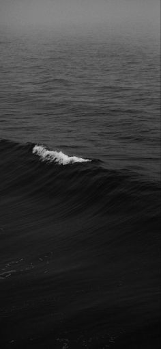 black and white photo of the ocean waves