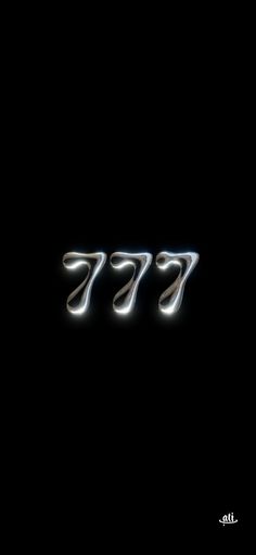 the number 777 is shown in silver on a black background