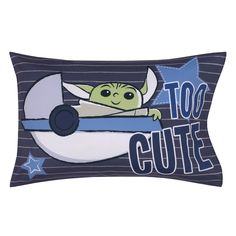 a rectangular pillow with an image of a baby yoda on the moon and words too cute