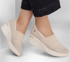 Celebrated lifestyle expert, Martha Stewart, delivers her one-of-a-kind touch to Skechers in this spirited collaboration. Shine on in fashionable flair wearing Martha Stewart x Skechers: Pier-Lite - Reflection. This casual fashion wedge features a Stretch Fit mesh knit upper with sparkle embellishments, a wedge midsole and a Skechers Air-Cooled Memory Foam insole. | Skechers Women's Martha Stewart: Pier-Lite - Reflection Slip-On Shoes | Medium Width | From the Martha Stewart x Skechers collabora Sister Missionary Outfits, Sister Missionaries, Wedges Style, Everyday Shoes, Skechers Women, 2 Inch Heels, Shine On, Martha Stewart, Beautiful Shoes