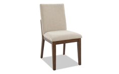 a chair that is upholstered in beige fabric