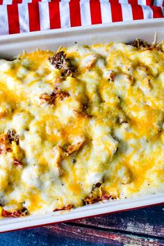 a casserole dish filled with cheese and meat