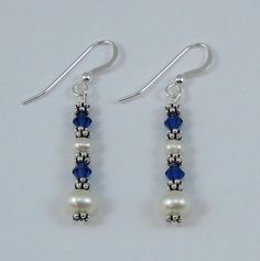 These are my signature earrings.  They are made with large and medium white pearls, Sapphire colored Swarovski  Crystals and sterling silver spacer beads.  They are designed to go with my necklace N105a. White Sterling Silver Jewelry With Spacer Beads, Elegant Dangle Earrings With Spacer Beads, Silver Beaded Sterling Silver Pearl Earrings, Beaded Sterling Silver Pearl Earrings, Elegant Earrings With Spacer Beads For Gift, Bead Embroidery Tutorial, Embroidery Tutorial, My Signature, North Hollywood