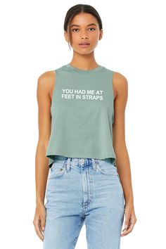 Pilates Shirts Women | Pilates Crop Top | Pilates Tank Top | Funny Pilates Shirt | Pilates Instructor | You Had Me at Feet in Straps THE CROP TANK   * Cropped, Relaxed Fit * Raw Cut Edge, Elongated Arm Holes * Racerback * Bella Canvas brand tank   T h e * F a b r i c * 52/48 airlume combed + ring-spun cotton/polyester jersey * Athletic Heather - 90/10 airlume combed + ring-spun cotton/polyester jersey   T h e * S i z e  * Please see size chart in photo scroller above for measurements. * If you prefer a longer/ looser fit, I do recommend choosing a size larger than your normal size; however, please note this is still a cropped style.   * Each shirt is made to order just for you by us in Ohio. Each item is custom created by hand with high quality vinyl that should not be ironed over. Please Women Kickboxing, Barre Shirts, Pilates Shirt, Boxing Shirts, Funny Gym Shirts, Gym Crop Top, Fitness Tank Top, Yoga Crop Tops, Funny Tank Tops