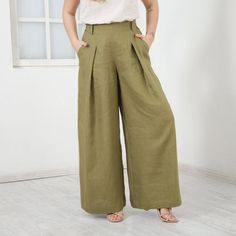 Linen Palazzo Pants JASMINE, Capri High Waisted Pants, Wide Leg Trousers, Pants With Pockets, Plus Size ClothingINFO:We love elegance and linen and we have created these beautiful soft fabric pants JASMINE for you! The long wide legs are pleated for even more splendor. The back-side of the waist is elastic to adjust any size. We have added same fabric belt which might be tied in different ways. You will find two pockets to put some trinkets in. Try this cut by all means – it will please you for Linen Palazzo Pants, Fabric Pants, Olive Green Pants, Purple Pants, Hooded Dress, Wide Leg Linen Pants, Pants With Pockets, Trousers Pants, Travel Wardrobe