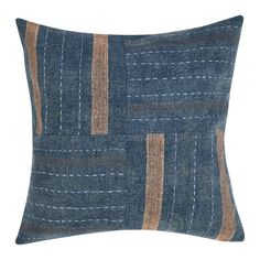 a blue and brown pillow with stripes on it's side, in front of a white background