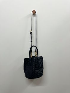 Introducing our Woven Bucket Bag, the perfect combination of luxury and practicality in one. Handcrafted with intricately woven details, this bag is not only visually stunning but also durable. Carry all your essentials in style with this exclusive piece, designed for the modern, sophisticated individual. Fabrication: Vegan Leather Measurements: 6.5" x 7" Versatile Satchel With Braided Handles For On-the-go, Woven Leather Crossbody Bucket Bag For On-the-go, Elegant Woven Leather Hobo Bag For Daily Use, Chic Woven Leather Hobo Bag For On-the-go, Modern Woven Leather Crossbody Bag, Luxury Crochet Leather Woven Shoulder Bag, Luxury Crochet Woven Leather Shoulder Bag, Luxury Crochet Shoulder Bag With Woven Leather, Chic Bucket Bags With Intrecciato Weave