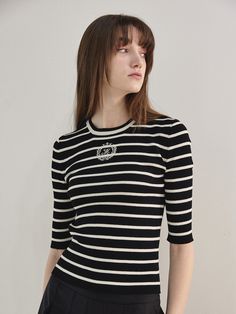 Editor's NotesThe Mare di mari’s new Logo Point Stripe Knit Top features a stripe pattern and a simple round neck pullover design, with the brand’s logo detail on the front center that creates a casual and trendy mood. The fabric is cool, light and elastic which adds to the comfortable wear.- Casual and trendy mood- Stripe pattern and brand’s logo detail- Cool light elastic fabric- Can be styled variouslyMeasurements(in.)One Size (XS-M)- Total length: 21.26 in.- Shoulder: 12.79 in.- Bust: 13.78 Chic Striped Crew Neck Sweater, Classic Crew Neck Top With Signature Stripes, Chic Striped Crew Neck Knit Top, Black Crew Neck Top With Signature Stripes, Classic Crew Neck Top With Striped Hem, Spring Tops With Signature Stripes, Fitted Striped Knit Top With Crew Neck, Fitted Striped Crew Neck Knit Top, Classic Striped Crew Neck Sweater