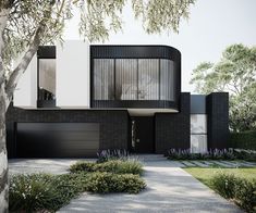 a black and white house surrounded by trees