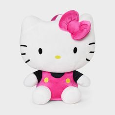 a hello kitty stuffed animal sitting on top of a white surface