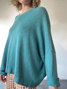 Vintage Shirin Guild Aqua Blue Sweater. Beautiful color in a soft knit. Excellent vintage condition. Fits most; very wide, cool slouchy look that's longer on the sides than front. Cotton and silk blend, with 1% elastane. Imported. Approx. Measurements: Length: front and back 20”, sides 27” Underarm to underarm: 38” Oversized Textured Knit Comfortable Sweater, Oversized Textured Knit Sweater, Oversized Soft Knit Top, Oversized Blue Knit Sweater, Oversized Relaxed Sweater For Layering, Oversized Textured Knit Top For Layering, Soft Knit Relaxed Fit Sweater, Oversized Relaxed Knit Tops, Blue Relaxed Fit Knit Top For Fall