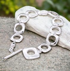 Add a touch of flair to your style with the Silver Geometric Square Link Bracelet. This gorgeous piece rocks a silver plated link chain, giving it a bold and trendy vibe. The chunky design makes it an awesome gift for her. Embrace the allure of large links and treat yourself to this fashionable accessory! ❗Bracelet with the extension will fit for 8" wrist size tight.   If you have a smaller wrist size, you can either take a link out or let me know your wrist size and we will shorten it for you. Silver Link Chain, Chunky Bracelet, Chunky Bracelets, Chain Silver, Silver Plated Jewelry, Statement Bracelet, Bracelet Silver, Chain Link Bracelet, Pure Silver