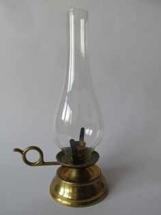 an old fashioned oil lamp on a white background