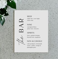 a menu for a bar with flowers on the table