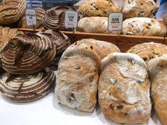 breads and pastries on display in a bakery