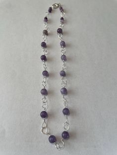 This delicate necklace is handmade with 6-mm smooth lavender chalcedony stone beads and silver wire. It is 16 inches long, but can be worn as a 15-inch necklace. Adjustable Purple Necklace With Dangling Beads, Purple Amethyst Beaded Necklace Gift, Lavender Amethyst Beaded Necklaces, Purple Amethyst Necklace With 8mm Beads, Elegant Purple Multi-strand Beaded Necklaces, Chalcedony Stone, Gemstone Beaded Necklace, Delicate Necklace, Silver Wire