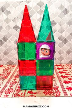 a toy made out of plastic blocks with an elf's head in the center