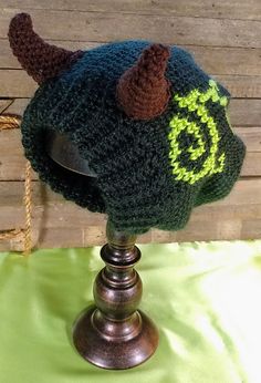 a knitted hat with horns on top of a table