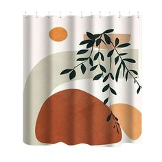 a shower curtain with an orange and white design on the outside, along with a tree branch