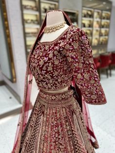 Unleash your inner royalty with our Maroon Multi Color Bridal Lehenga BL-145! Made from luxurious velvet and adorned with intricate resham work and gold zardozi, this lehenga is sure to make a statement. Perfect for any bride looking to make a stunning entrance on her special day. Fabric: Velvet! WASH CARE INSTRUCTIONS - Please Dry clean only when it is applicable! Ready to Ship! Heavy Traditional Drape Dupatta For Festive Occasions, Festive Heavy Dupatta In Traditional Drape, Festive Heavy Traditional Dupatta, Festive Semi-stitched Heavy Lehenga, Festive Heavy Traditional Drape Sets, Festive Sets With Traditional Drape, Traditional Heavy Lehenga With Traditional Drape, Heavy Anarkali Dupatta With Traditional Drape, Designer Velvet Traditional Wear With Pallu