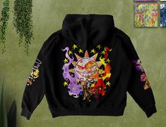 a black hoodie with colorful images on it