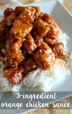 a white plate topped with rice and meat covered in gravy on top of it