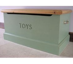 a green toy box with the word toys on it's front and side panels