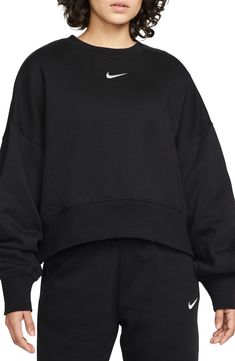 An embroidered Swoosh adds minimal branding to this cozy fleece sweatshirt cut for a relaxed, oversized fit that's enhanced by the dropped shoulders. 22" length (size Medium) Crewneck 80% cotton, 20% polyester Machine wash, tumble dry Imported Nike Phoenix Fleece, Nike Crew Neck, Nike Sportswear Women, Nike Crewneck, Women's Sportswear, Nike Fleece, Oversized Crewneck, Cut Sweatshirts, Nike Sweater