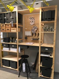 a room with shelves, lights and various items on display in the store's showroom