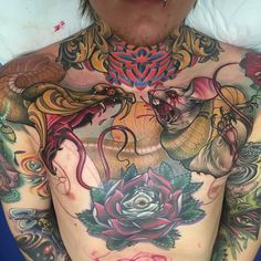 a man with many tattoos on his chest