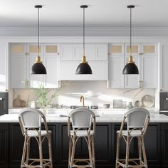 three stools sit in front of a kitchen island