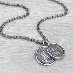 "Oxidised solid Sterling silver replica Roman coin circle framed pendants on a choice of spiga or round box chain - Men's jewellery To offer the chain variations for this item each chain length is made to order. Please allow up to 1 week for the item to be ready to post. Please check the shop announcement section for any current updates, potential disruptions and extra info regarding ordering. This can be found on the main shop page. An all over oxidised brushed finish with a polished silver frame. Solid Sterling silver pendant size - 23mm  (31mm long with jump ring) Solid Sterling silver pendant size - 21mm  (28mm long with jump ring) A choice of oxidised matt finish Sterling silver chain styles -  4.2mm wide filed trace chain - 20\", 22\", 24\", 26\", 28\" 2.5mm wide round box chain - 20 Silver Sterling Silver Coin Necklace With Oxidized Finish, Classic Silver Necklace With Coin Pendant, Classic Engraved Sterling Silver Coin Necklace, Silver Oxidized Finish Coin Necklace For Gift, Sterling Silver Oxidized Medallion Coin Necklace, Sterling Silver Medallion Coin Necklace With Oxidized Finish, Classic Silver Coin Pendant Necklace, Silver Coin Necklace With Oxidized Round Pendant, Sterling Silver Oxidized Coin Necklace