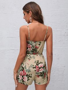 This bohemian-inspired Surplice Neck Floral Sleeveless Cami Romper makes a chic statement with its wrap-style silhouette and luxurious woven fabric. Highlighting a delicate spaghetti strap neckline, this timeless piece boasts a unique combination of style and comfort for a one-of-a-kind look. Perfect for a summer gathering, this cami romper brings effortless sophistication to any ensemble. Specifications: Style: Boho Pattern Type: Floral Type: Cami Details: Wrap Length: Short Fit Type: Regular F Comfy Jumpsuits, Cami Romper, Floral Type, Summer Gathering, Clean Body, Boho Patterns, Black Romper, Floral Sleeveless, Style Boho