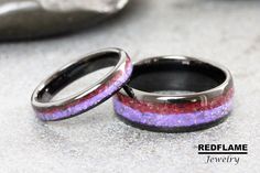 two wedding rings with purple and red glitter in them