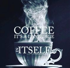 a cup with steam rising out of it and the words coffee its a language itself