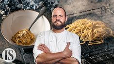 a man standing next to a bowl of spaghetti