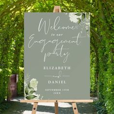 an easel with a sign that says welcome to our engagement party