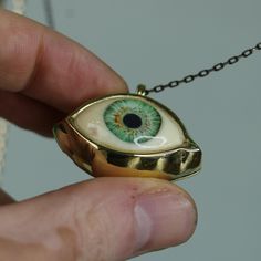 Green Big Eye Pendant, Evil Eye Talisman Pendant, Glass Green Eye Necklace, Evil Eye Necklace, Eye Jewelry, Gift Idea, Handmade Eye Jewelry My eye designs can be made specifically for your eyes, you need to take a beautiful iris photo for us. Then we can customize it for you. You can also add or remove blood details to our eye designs. You can write this in the order notes. Please send me a message after ordering. I can do as you wish. A quasi-universal symbol of protection, the evil eye is refe Eye-shaped Amulet Necklace As Gift, Brass Evil Eye Jewelry For Gifts, Evil Eye Brass Jewelry As A Gift, Brass Evil Eye Jewelry As A Gift, Amulet Eye Necklace Gift, Symbolic Eye-shaped Jewelry Gift, Unique Evil Eye Jewelry Gift, Unique Evil Eye Jewelry As A Gift, Handmade Symbolic Green Necklace