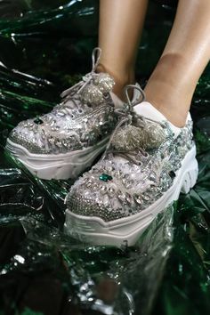 Silver sneakers embellished with sequin and bead floral motifs. - Aza Fashions Silver And Emerald Green, Embellished Sneakers, Shoe Makeover, Cloth Store, Floral Sneakers, Silver Sneakers, Luxury Sale, Silver Shoes, Fashion App