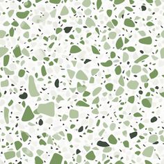 a green and white background with black dots