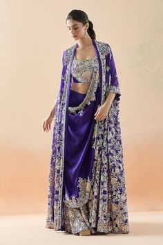 Purple sharara with resham, sequin, zari thread, bead embroidery in floral pattern on border. Paired with floral yoke embroidered blouse, border embroidered drape and longline jacket. - Aza Fashions Bollywood Style Side Open Wedding Set, Front Open Lehenga With Resham Embroidery For Diwali, Diwali Lehenga With Resham Embroidery, Diwali Front Open Lehenga With Zari Work, Bollywood Style Front Open Palazzo Set For Wedding, Wedding Set With Dupatta And Side Open Design, Wedding Sets With Dupatta And Side Open Design, Wedding Sets With Side Open Dupatta, Bollywood Style Lehenga With Zari Work And Front Open