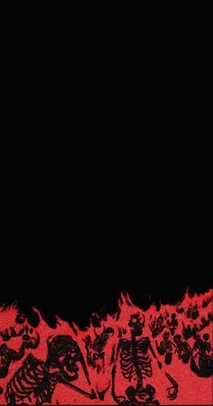 a black and red photo with skulls on it's sides, in front of a dark background